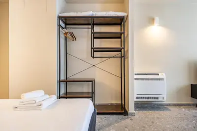 a room with a bunk bed with towels at Turrisi Apartment in Palermo