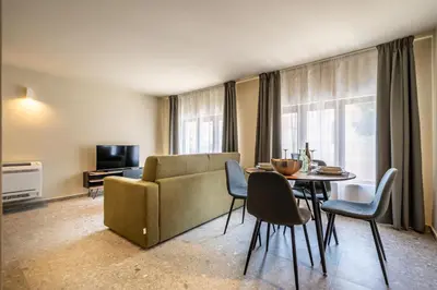 a living room with a couch and a table at Turrisi Apartment in Palermo