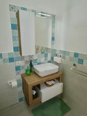 a bathroom with a sink and a mirror at Casetta al Duomo in Monreale