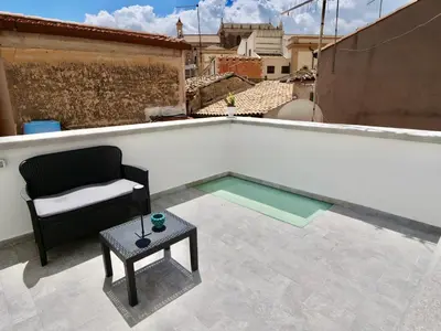 a small swimming pool on the roof of a building at Casetta al Duomo in Monreale