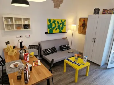 a living room with a couch and a table at Il Fico d'India by Holiday World in Palermo