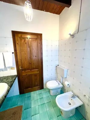 a bathroom with a toilet and a sink at Mandarhouse Dante in Palermo