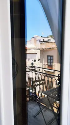 a view of a balcony from a window at Disìu Apartment con Jacuzzi in centro a Castellammare del Golfo in Scopello