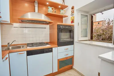 a kitchen with a sink and a stove top oven at A 2 passi dal Teatro Massimo in Palermo