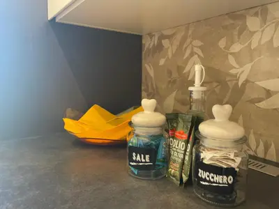 two alcohol bottles sitting on a counter in a room at Il Sole di Palermo in Palermo