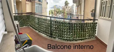 a balcony of a building with a scooter on it at Il Sole di Palermo in Palermo