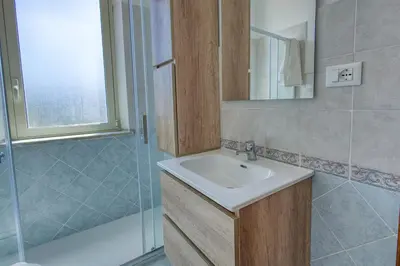 a bathroom with a sink and a shower at Villa Mare Blu in Ficarazzi