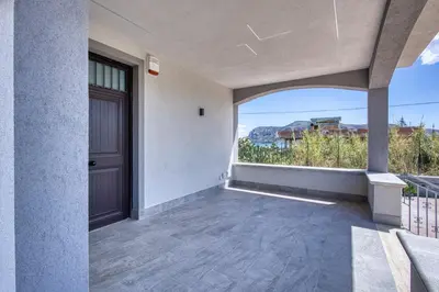 an empty porch with a door and a view at Villa Mare Blu in Ficarazzi