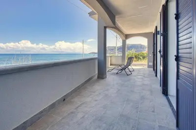an empty balcony with a view of the ocean at Villa Mare Blu in Ficarazzi
