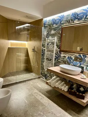 a bathroom with a shower and a sink and a tub at Fervore Luxury Rooms-Apartments in Palermo