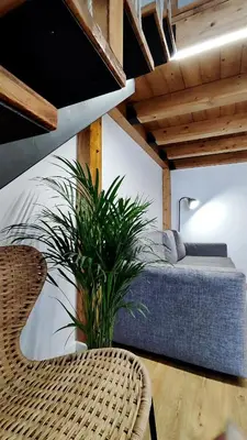 a bedroom with a white bed and a lamp at Disíu Apartment con jacuzzi in pieno centro in Castellammare del Golfo