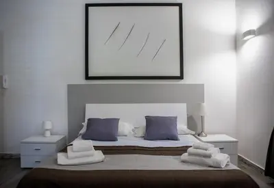 a bedroom with a large bed with towels on it at Palermo al Centro - Appartamento Fiume in Palermo