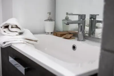 a bathroom sink with a towel sitting on top of it at Palermo al Centro - Appartamento Fiume in Palermo