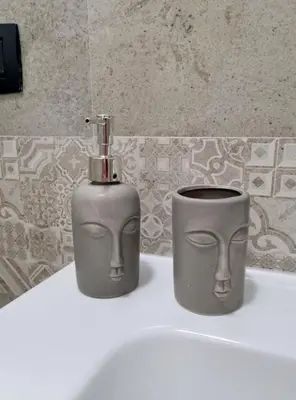 two vases sitting on top of a bathroom sink at Casa Marì-Albergheria in Palermo's historic center in Palermo