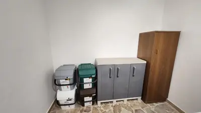 a room with two filing cabinets next to a wall at La casetta di Totò in Palermo