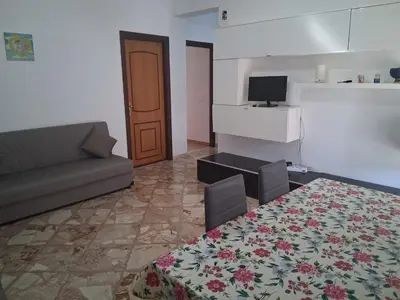 a living room with a couch and a table at Casa Lety in Palermo