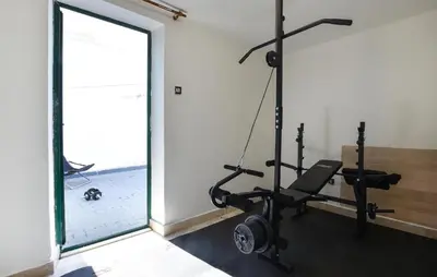 a room with a gym with a treadmill at Nice Home In Capaci With Wifi in Capaci