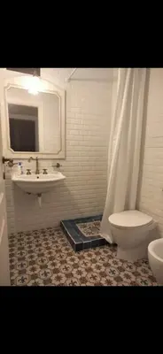 a bathroom with a sink and a toilet and a mirror at Vista mare 360 in Scopello