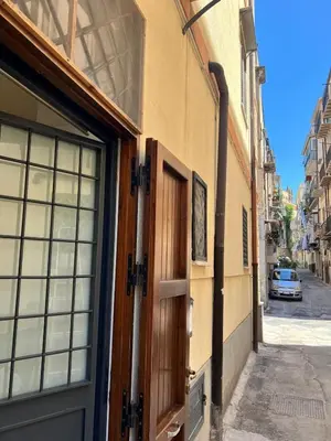 an entrance to a building with a door at Kiccifù home in Palermo