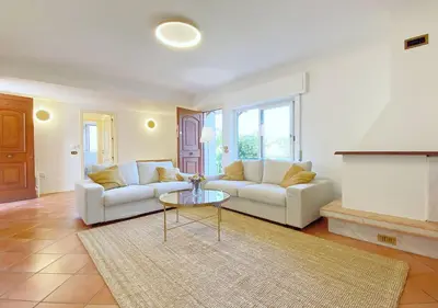 a living room with a couch and a table at Solemar Sicilia - Villa Alma in Palermo