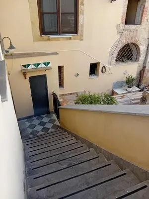 a set of stairs leading up to a building at Vernagallo's house in Palermo