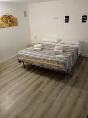 a bedroom with a bed with two towels on it at Vernagallo's house in Palermo