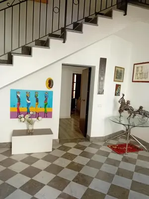 a room with a staircase and a checkered floor at Vernagallo's house in Palermo
