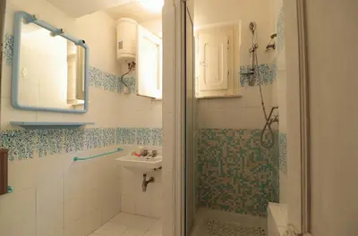 a bathroom with a shower and a sink at Villa Barbera - Terrace overlooking the sea in Bagheria