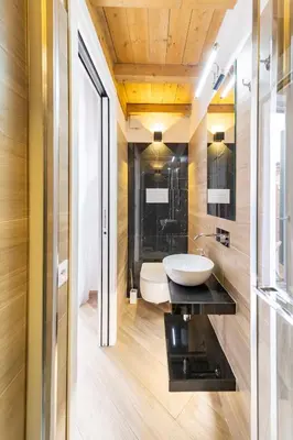a bathroom with a sink and a mirror at Casa Clio - Mondello Home in Palermo