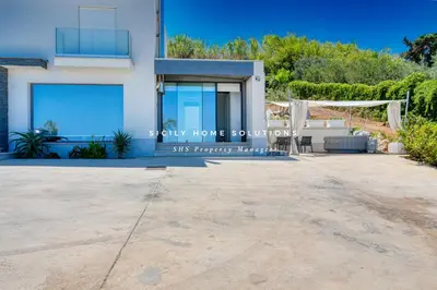 a villa with a view of the ocean at Appartamento in villa vista mare con jacuzzi By Sicily Home Solutions in Balestrate