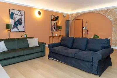 a living room with two couches and a couch at 4Quarti in Palermo
