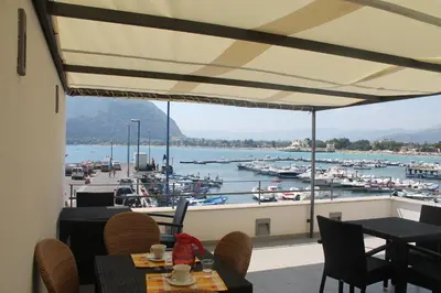 a restaurant with a view of a marina at b&b Simpaty in Mondello