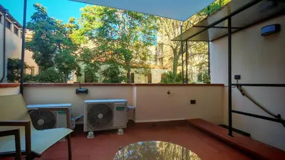 a balcony with two air conditioners in a building at Qanat House con Terrazzo Privato in Palermo