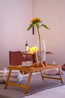 a wooden coffee table with a vase on top of it at Corallo - Cantunera Old Town Apartments in Palermo