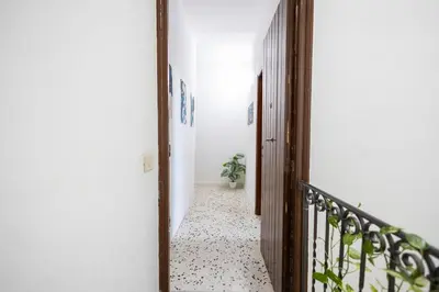 a hallway with a door leading to a room at inHouse Palermo in Palermo