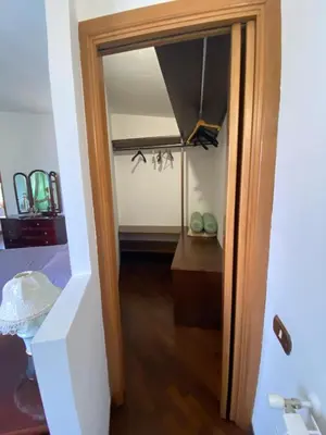 a hallway with a door leading into a room at Casa Mini' in Palermo