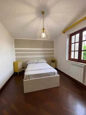 a bedroom with a bed and a ceiling at Casa Mini' in Palermo