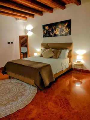a bedroom with a large bed in a room at Bellini al Massimo in Palermo