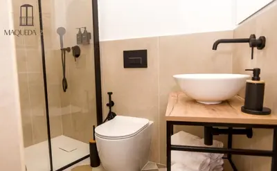 a bathroom with a toilet and a sink and a shower at Maqueda 259 - In Palermo's Lively Heart in Palermo