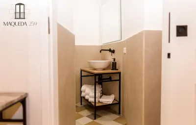 a bathroom with a sink and a bowl on a shelf at Maqueda 259 - In Palermo's Lively Heart in Palermo