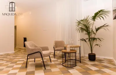 a waiting room with chairs and a potted plant at Maqueda 259 - In Palermo's Lively Heart in Palermo