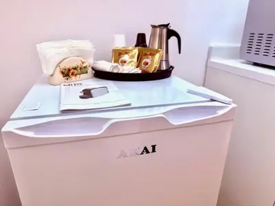 a kitchen with a sink and a washing machine at Casetta Lulù Palermo centro in Palermo