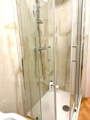 a shower with a glass door in a bathroom at Casetta Lulù Palermo centro in Palermo