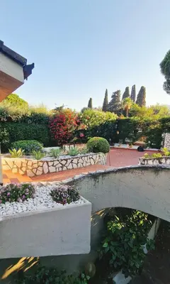 a walkway with potted plants in a building at Villa Domus Dea Mondello in Mondello