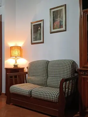 a couch sitting in a living room with a lamp at CAGNINA Apartments in Balestrate