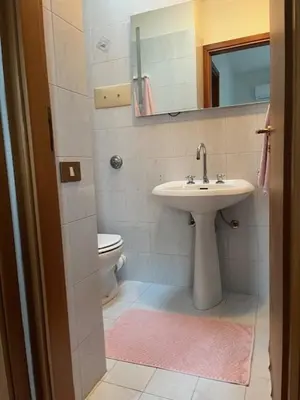 a bathroom with a sink and a toilet at Casa Sole e Limone in Castellammare del Golfo