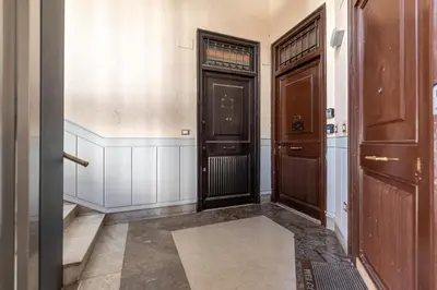 a hallway with two doors in a building at Panurban Apartments by Wonderful Italy in Palermo