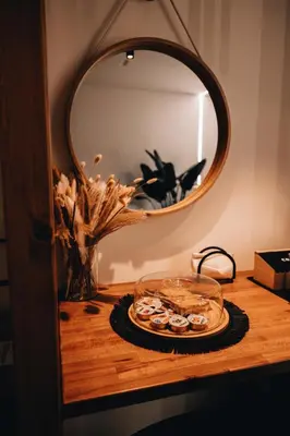 a plate of food on a table in front of a mirror at Suite le palme in Aspra