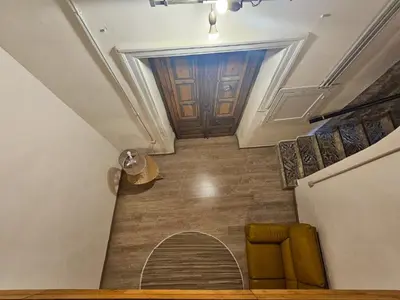 a stairway with a hallway with a room with a door at A al Quadrato in Palermo