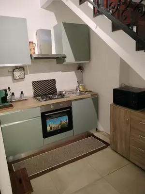 a kitchen with a stove and a sink at Joy House in Palermo